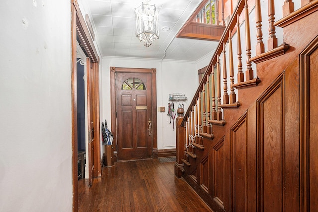 429 Portage Ave, Three Rivers, MI 49093 - foyer featuring dark wood-style floors, a chandelier, stairs, and crown molding