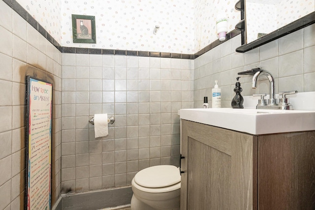 429 Portage Ave, Three Rivers, MI 49093 - bathroom featuring tile walls, vanity, and wallpapered walls