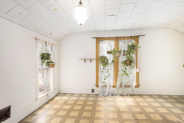 429 Portage Ave, Three Rivers, MI 49093 - spare room with vaulted ceiling and baseboards