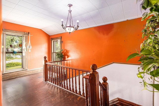 429 Portage Ave, Three Rivers, MI 49093 - staircase featuring a chandelier, lofted ceiling, and wood finished floors