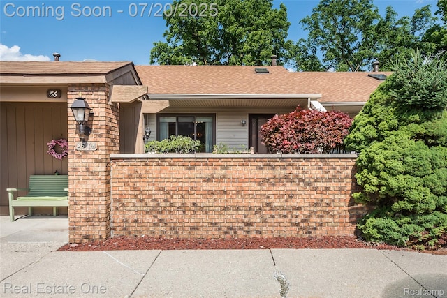 25104 Hamilton Ct Unit 4, South Lyon, MI 48178 - view of front of home with roof with shingles