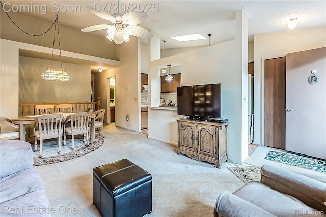 25104 Hamilton Ct Unit 4, South Lyon, MI 48178 - living area featuring light colored carpet, ceiling fan, and lofted ceiling