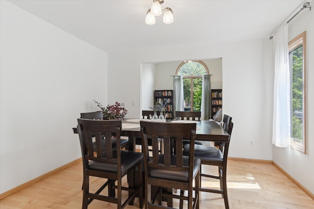 2388 Chestnut Cres, Saline, MI 48176 - dining area featuring light wood finished floors and healthy amount of natural light