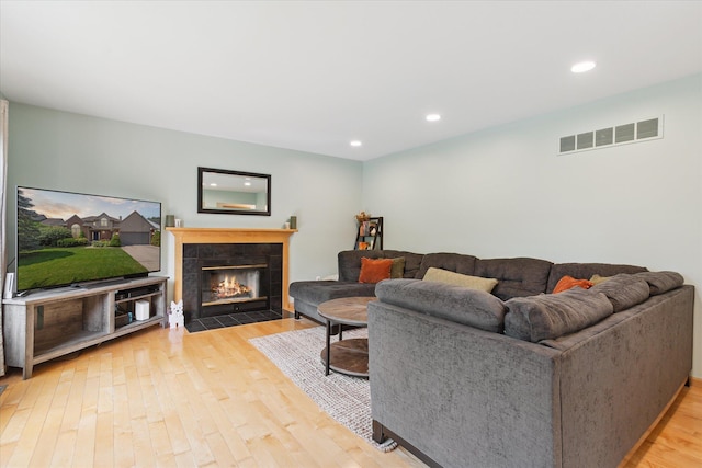 2388 Chestnut Cres, Saline, MI 48176 - living area featuring wood finished floors, a fireplace, and recessed lighting
