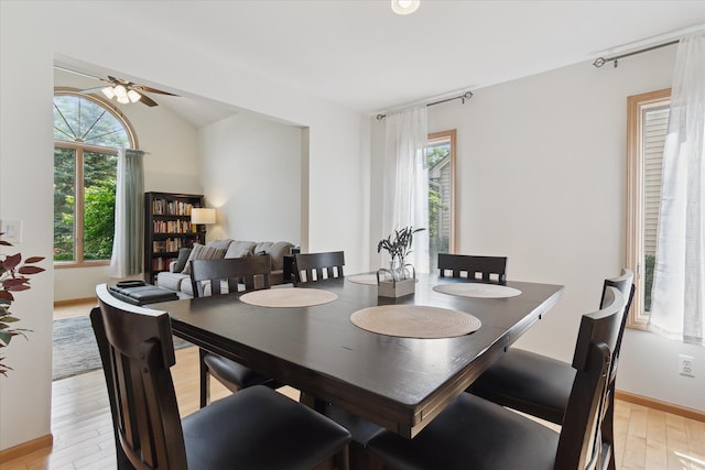 2388 Chestnut Cres, Saline, MI 48176 - dining area with light wood finished floors, a ceiling fan, and lofted ceiling