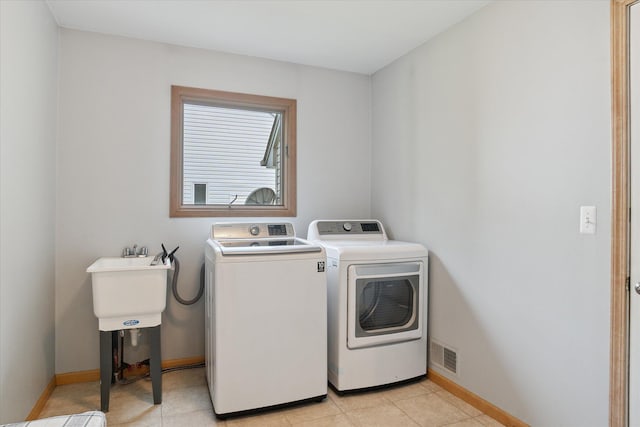 2388 Chestnut Cres, Saline, MI 48176 - laundry room featuring independent washer and dryer and light tile patterned flooring