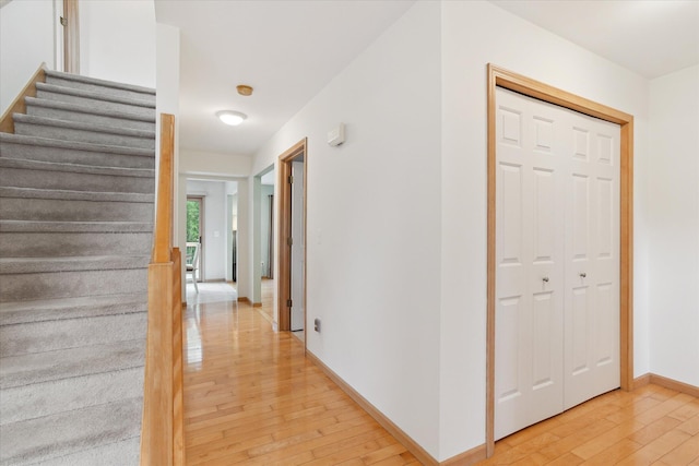2388 Chestnut Cres, Saline, MI 48176 - hall with light wood-type flooring and stairs