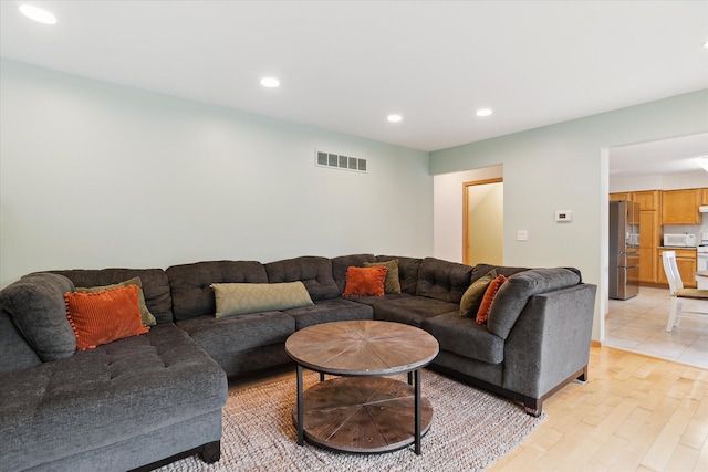2388 Chestnut Cres, Saline, MI 48176 - living area featuring light wood-style flooring and recessed lighting