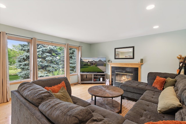 2388 Chestnut Cres, Saline, MI 48176 - living area with light wood-style flooring, recessed lighting, and a fireplace