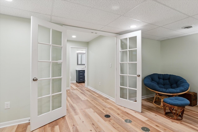 2388 Chestnut Cres, Saline, MI 48176 - sitting room featuring french doors, wood finished floors, a paneled ceiling, and recessed lighting