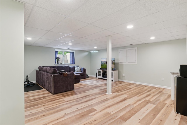 2388 Chestnut Cres, Saline, MI 48176 - living room with light wood-type flooring, a paneled ceiling, and recessed lighting