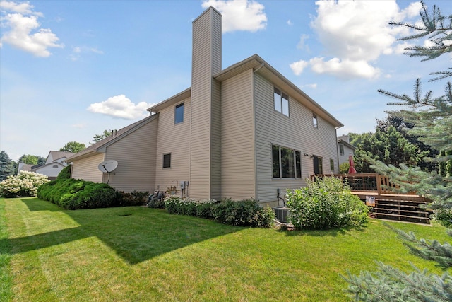 2388 Chestnut Cres, Saline, MI 48176 - view of side of home with a chimney, a yard, and a wooden deck