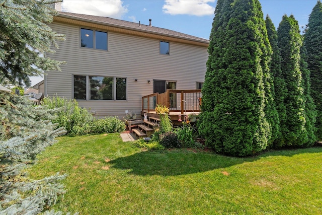 2388 Chestnut Cres, Saline, MI 48176 - back of house with a wooden deck and a yard