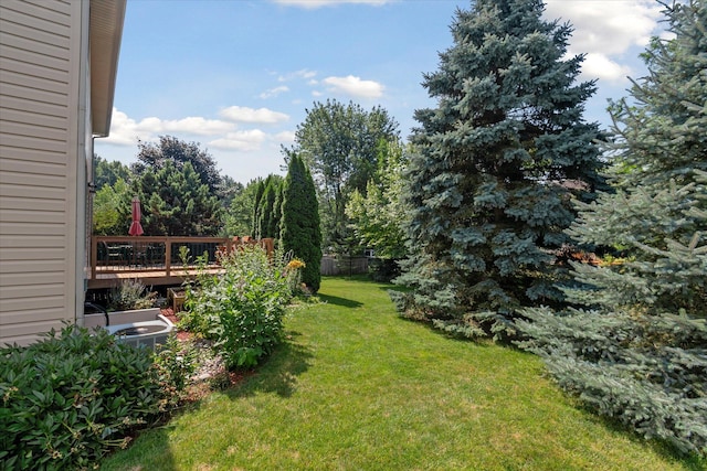 2388 Chestnut Cres, Saline, MI 48176 - view of grassy yard featuring a wooden deck