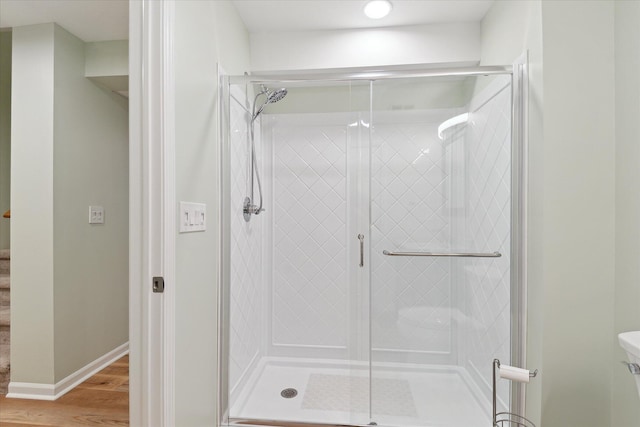 2388 Chestnut Cres, Saline, MI 48176 - bathroom with a stall shower and wood finished floors