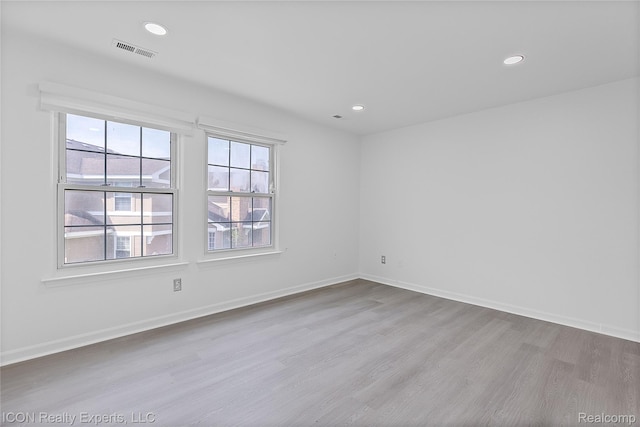 6614 Embers Ct, West Bloomfield, MI 48322 - spare room with wood finished floors and recessed lighting