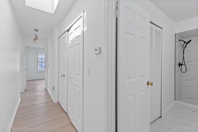 6614 Embers Ct, West Bloomfield, MI 48322 - hall featuring baseboards and a skylight
