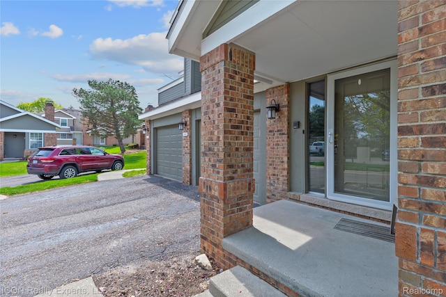 6614 Embers Ct, West Bloomfield, MI 48322 - entrance to property with brick siding, a garage, and driveway