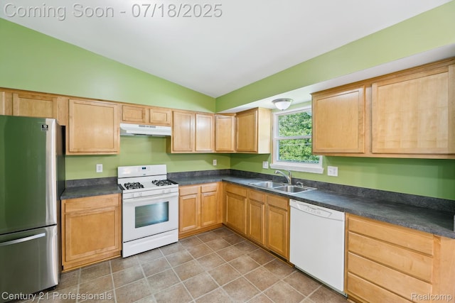 1605 N Hanlon St, Westland, MI 48185 - kitchen featuring white appliances, under cabinet range hood, vaulted ceiling, and dark countertops
