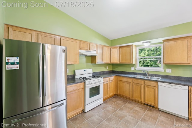 1605 N Hanlon St, Westland, MI 48185 - kitchen featuring white appliances, under cabinet range hood, vaulted ceiling, dark countertops, and light brown cabinets