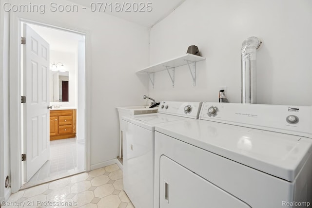 1605 N Hanlon St, Westland, MI 48185 - laundry area featuring washing machine and clothes dryer and light tile patterned floors