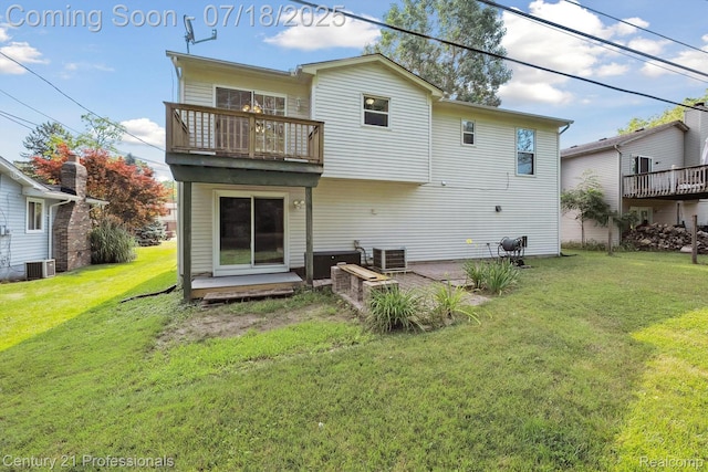 1605 N Hanlon St, Westland, MI 48185 - rear view of property with a balcony, a lawn, and a patio area