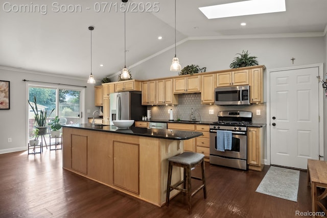 3290 Welch, Commerce Twp, MI 48390 - kitchen with appliances with stainless steel finishes, a skylight, dark countertops, an island with sink, and decorative backsplash