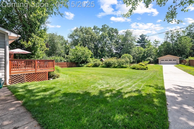 3290 Welch, Commerce Twp, MI 48390 - view of yard featuring a garage, an outbuilding, a deck, and view of scattered trees