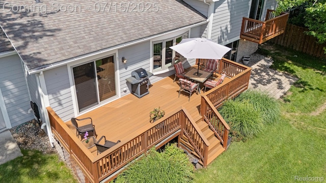 3290 Welch, Commerce Twp, MI 48390 - wooden deck with area for grilling, stairway, and outdoor dining area
