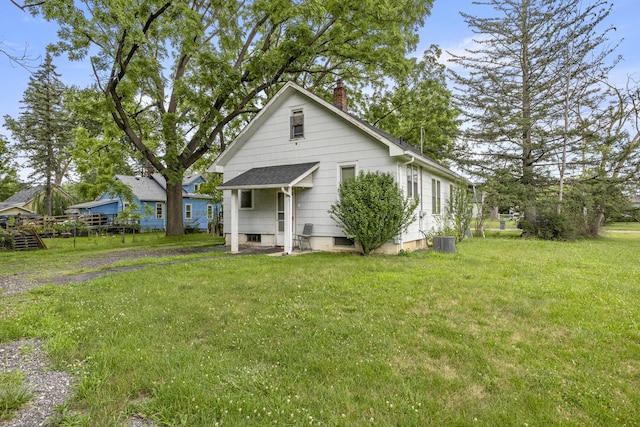 622 Tromley St, Inkster, MI 48141 - view of front of property featuring a chimney, a front lawn, and roof with shingles