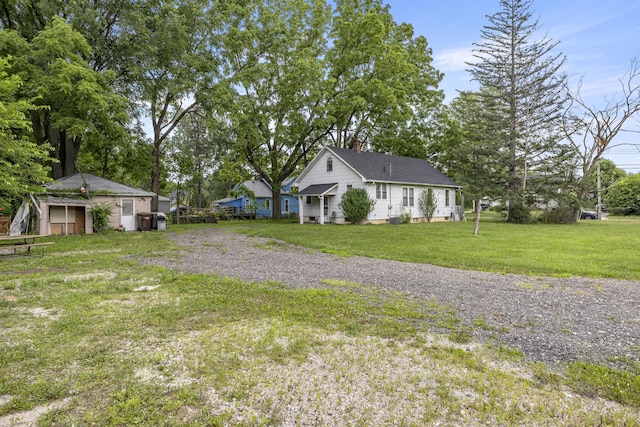 622 Tromley St, Inkster, MI 48141 - view of home's exterior with a chimney and a lawn
