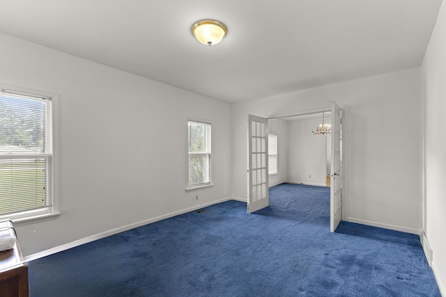 622 Tromley St, Inkster, MI 48141 - carpeted spare room with a chandelier and baseboards