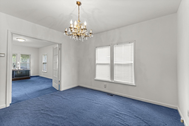 622 Tromley St, Inkster, MI 48141 - empty room featuring a chandelier and dark colored carpet
