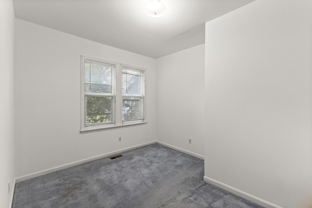 622 Tromley St, Inkster, MI 48141 - empty room with dark carpet and baseboards