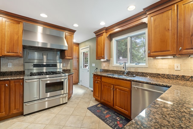 2113 Ridgeway Rd, Jackson, MI 49203 - kitchen featuring stainless steel appliances, wall chimney exhaust hood, tasteful backsplash, and recessed lighting