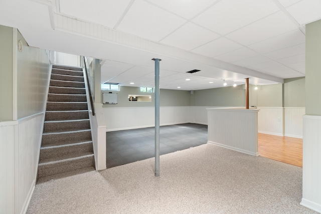 2113 Ridgeway Rd, Jackson, MI 49203 - below grade area with carpet, a wainscoted wall, and stairway