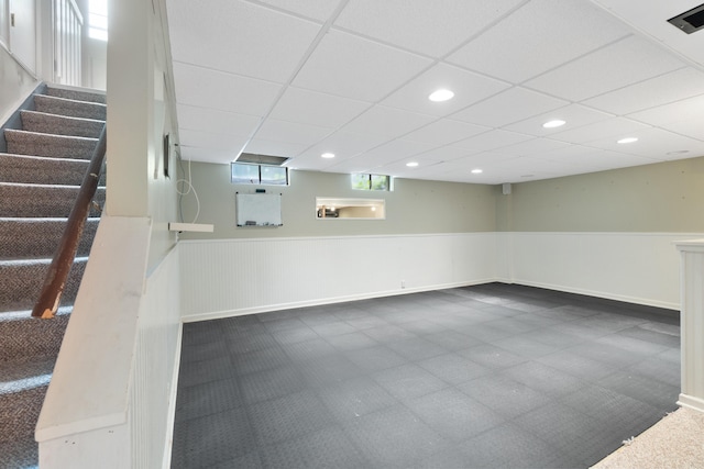 2113 Ridgeway Rd, Jackson, MI 49203 - below grade area with wainscoting, stairway, recessed lighting, and a drop ceiling