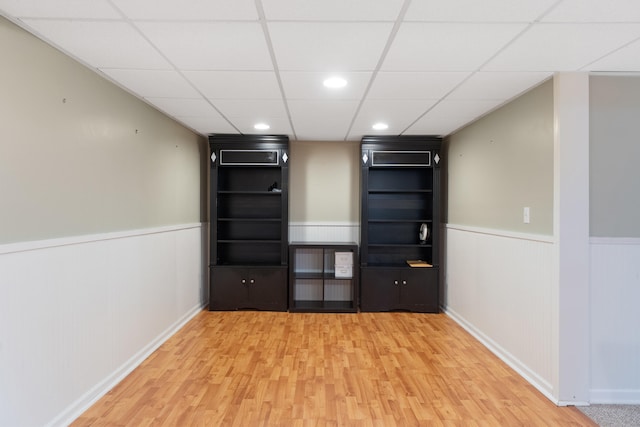 2113 Ridgeway Rd, Jackson, MI 49203 - spare room featuring wainscoting, wood finished floors, recessed lighting, and a paneled ceiling