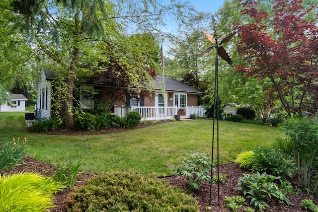2113 Ridgeway Rd, Jackson, MI 49203 - view of front of home with a front yard and brick siding