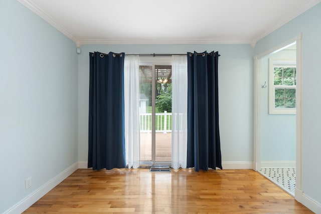 2113 Ridgeway Rd, Jackson, MI 49203 - unfurnished room with crown molding and light wood-type flooring