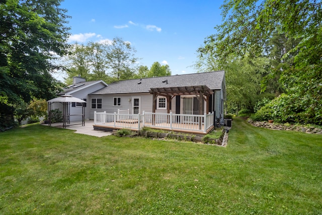 2113 Ridgeway Rd, Jackson, MI 49203 - back of house featuring a gazebo, a pergola, a wooden deck, and a yard