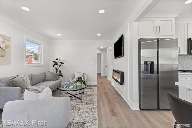 29924 Taylor St, Saint Clair Shores, MI 48082 - living room featuring heating unit, light wood-type flooring, a fireplace, and recessed lighting