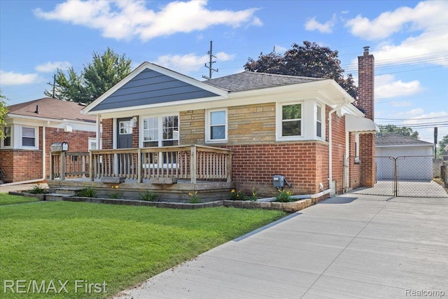 29924 Taylor St, Saint Clair Shores, MI 48082 - view of front of home with a chimney, a front yard, brick siding, an outdoor structure, and covered porch
