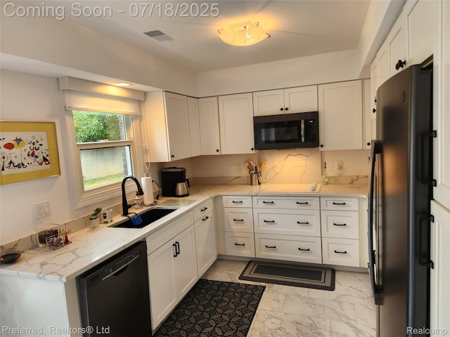 19370 W 11 Mile Rd, Lathrup Village, MI 48076 - kitchen with black appliances, light marble finish flooring, and white cabinetry