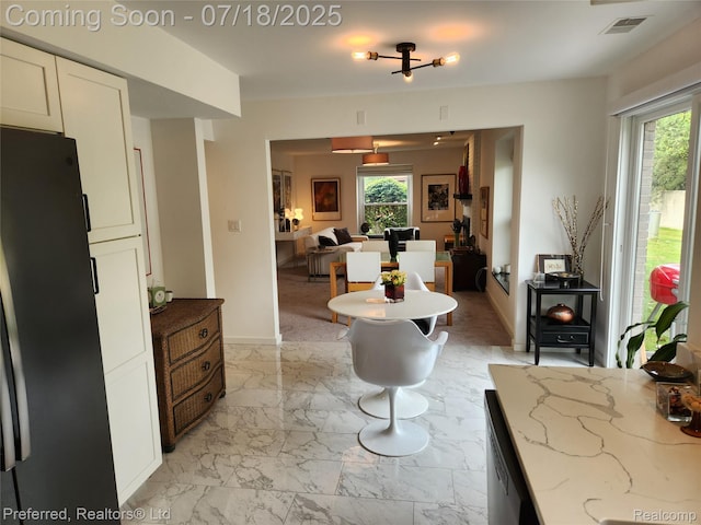 19370 W 11 Mile Rd, Lathrup Village, MI 48076 - living room with healthy amount of natural light and light marble finish flooring