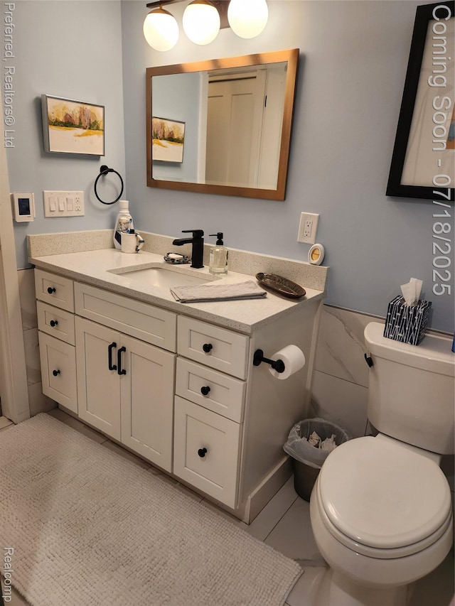 19370 W 11 Mile Rd, Lathrup Village, MI 48076 - bathroom featuring vanity, tile patterned floors, and tile walls