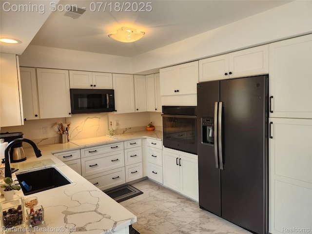 19370 W 11 Mile Rd, Lathrup Village, MI 48076 - kitchen featuring black appliances, light marble finish flooring, white cabinets, light stone countertops, and recessed lighting