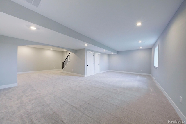 MOH45 Birkdale Dr Unit 45, Howell, MI 48843 - below grade area with recessed lighting, stairway, and light colored carpet