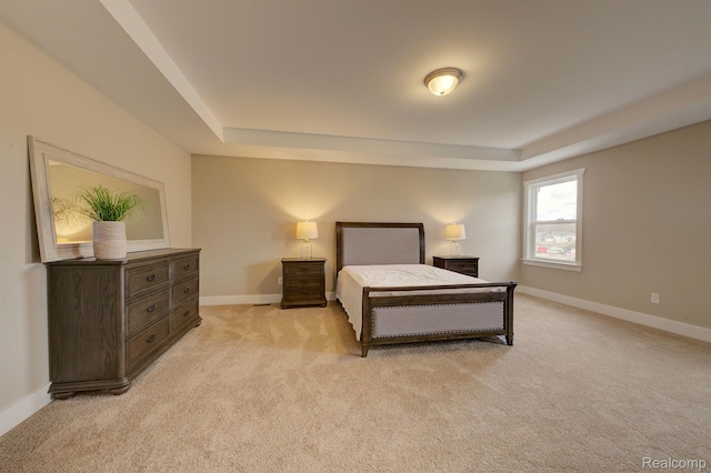 MOH45 Birkdale Dr Unit 45, Howell, MI 48843 - bedroom with a raised ceiling and light colored carpet