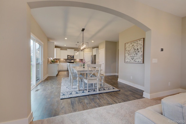MOH45 Birkdale Dr Unit 45, Howell, MI 48843 - dining room with recessed lighting, wood finished floors, arched walkways, and a chandelier